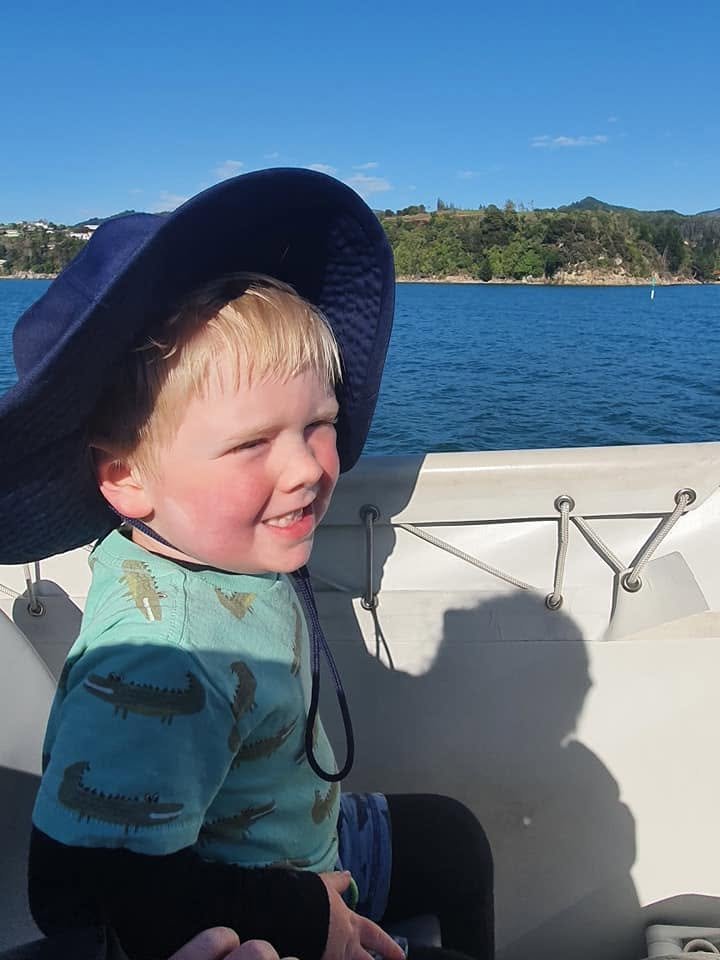 Harvey smiling on a boat trip